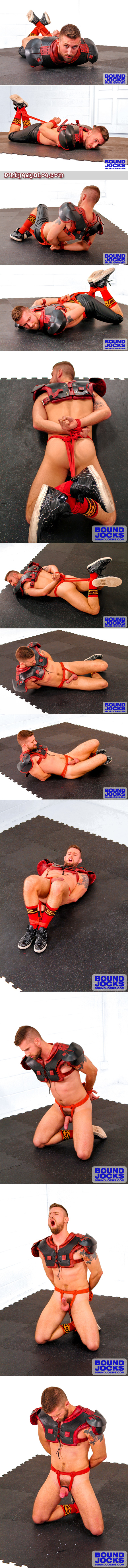 Blonde football player with a beard is hogtied in his uniform and gives himself an orgasm using the ropes.