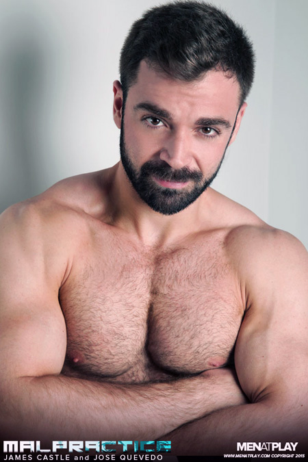 Bearded Latino muscle bear shirtless and showing off his huge arms.
