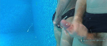 Young man in a Speedo ejaculating underwater.
