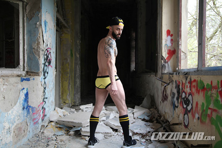 Middle Eastern German stud in yellow briefs and OTC rugby socks.